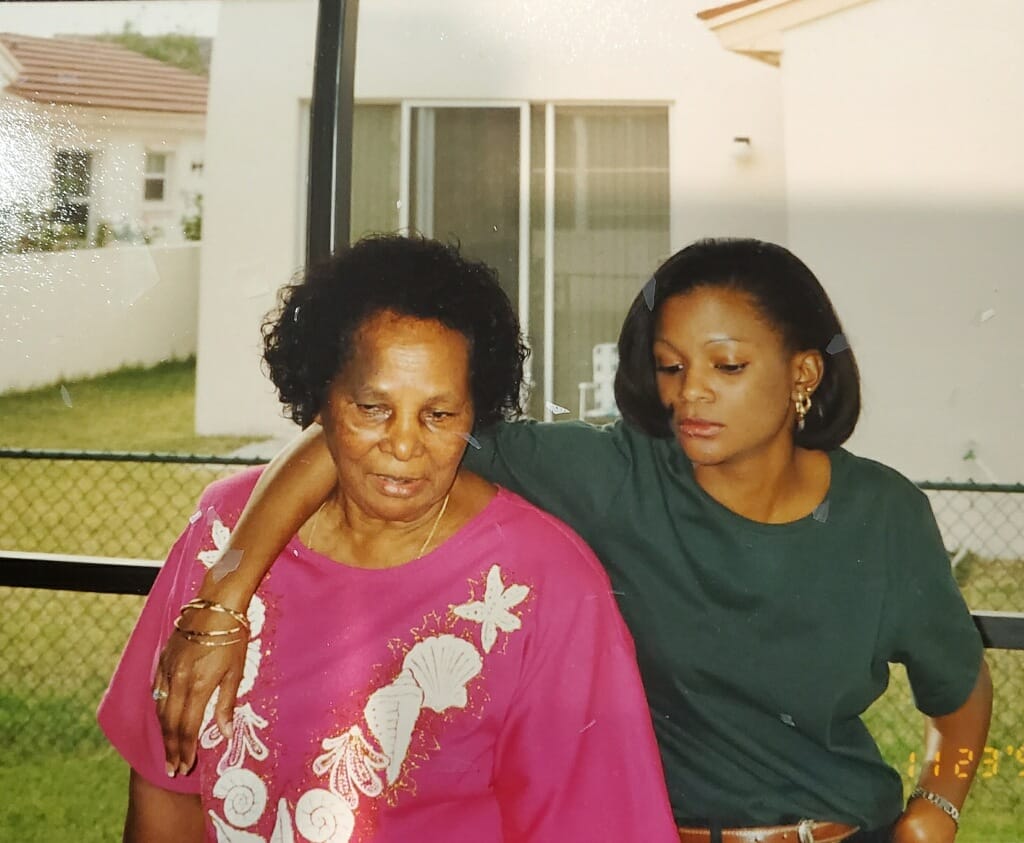 Grandmother Daisy and her granddaughter sharing a tender moment together outdoors